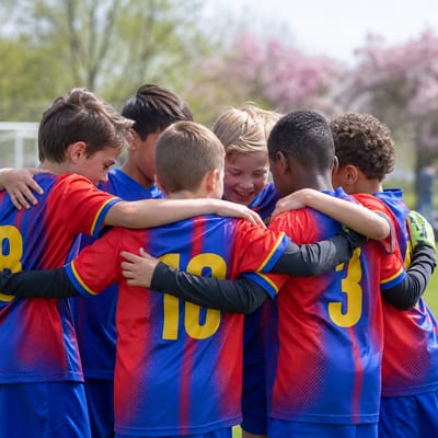 Kids soccer team huddle